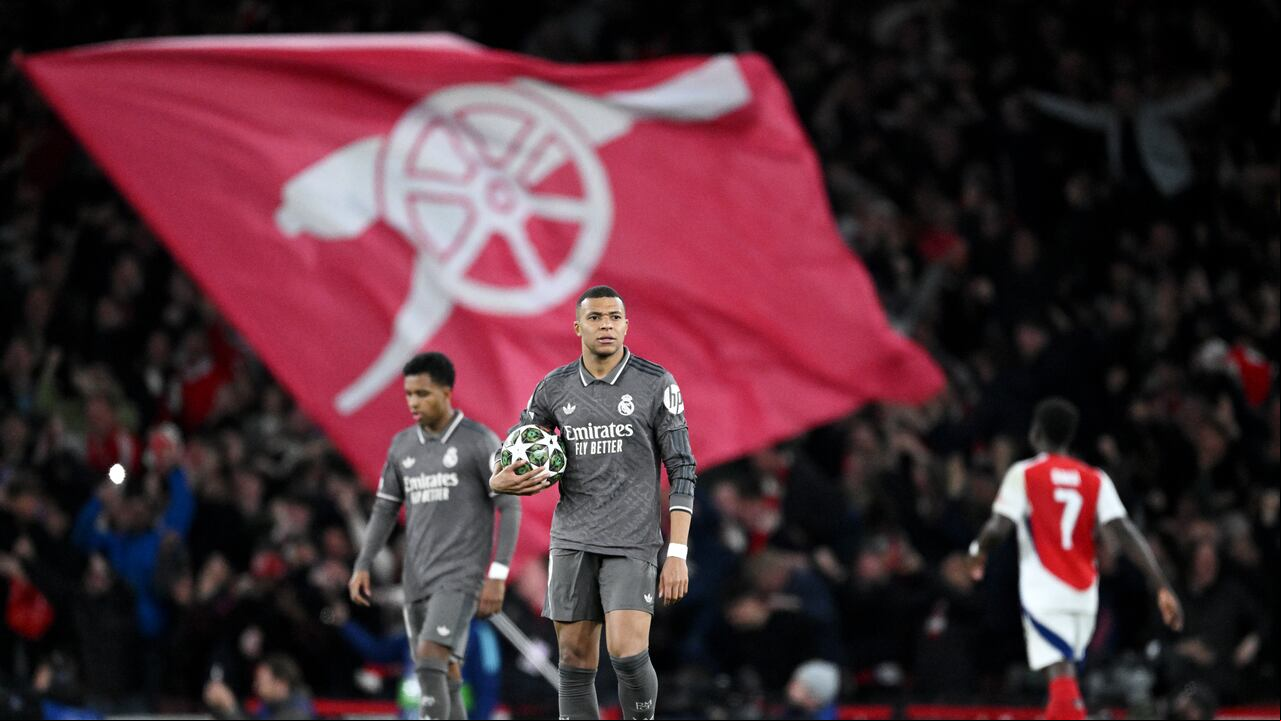 LONDON, ENGLAND - APRIL 08: Kylian Mbappe of Real Madrid holds the ball as he prepares to restart play after Declan Rice of Arsenal (not pictured) scores his team's second goal during the UEFA Champions League 2024/25 Quarter Final First Leg match between Arsenal FC and Real Madrid C.F. at Emirates Stadium on April 08, 2025 in London, England. (Photo by Justin Setterfield/Getty Images)