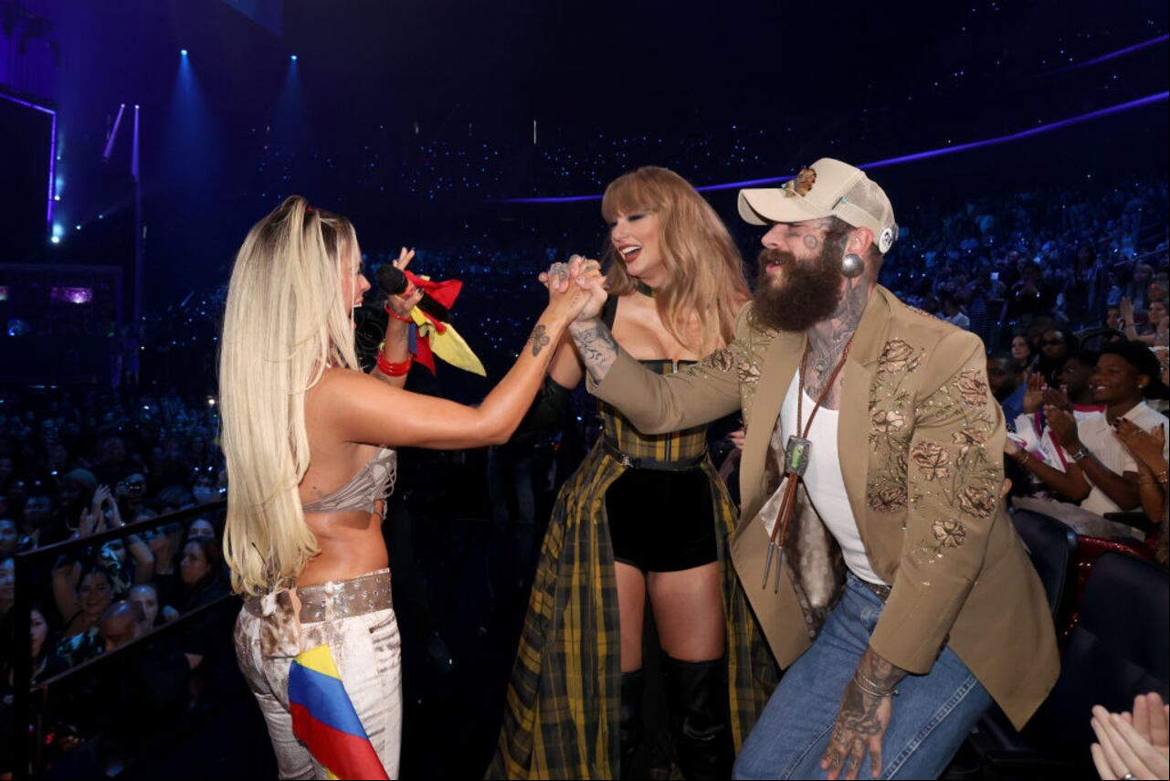 ELMONT, NEW YORK - SEPTEMBER 11: (L-R) Karol G, Taylor Swift and Post Malone attend the 2024 MTV Video Music Awards at UBS Arena on September 11, 2024 in Elmont, New York. (Photo by Johnny Nunez/Getty Images for MTV)