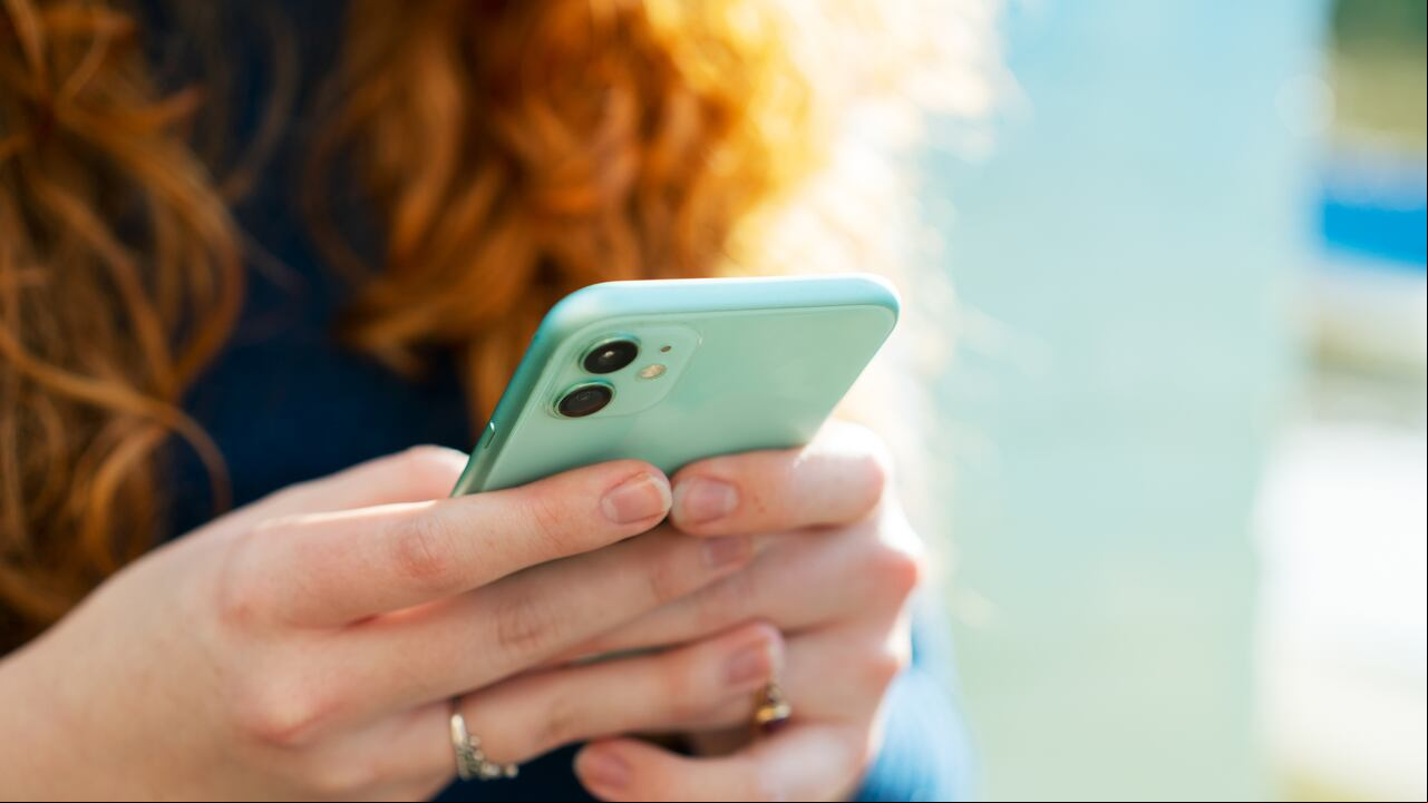 Close up or woman using smart phone