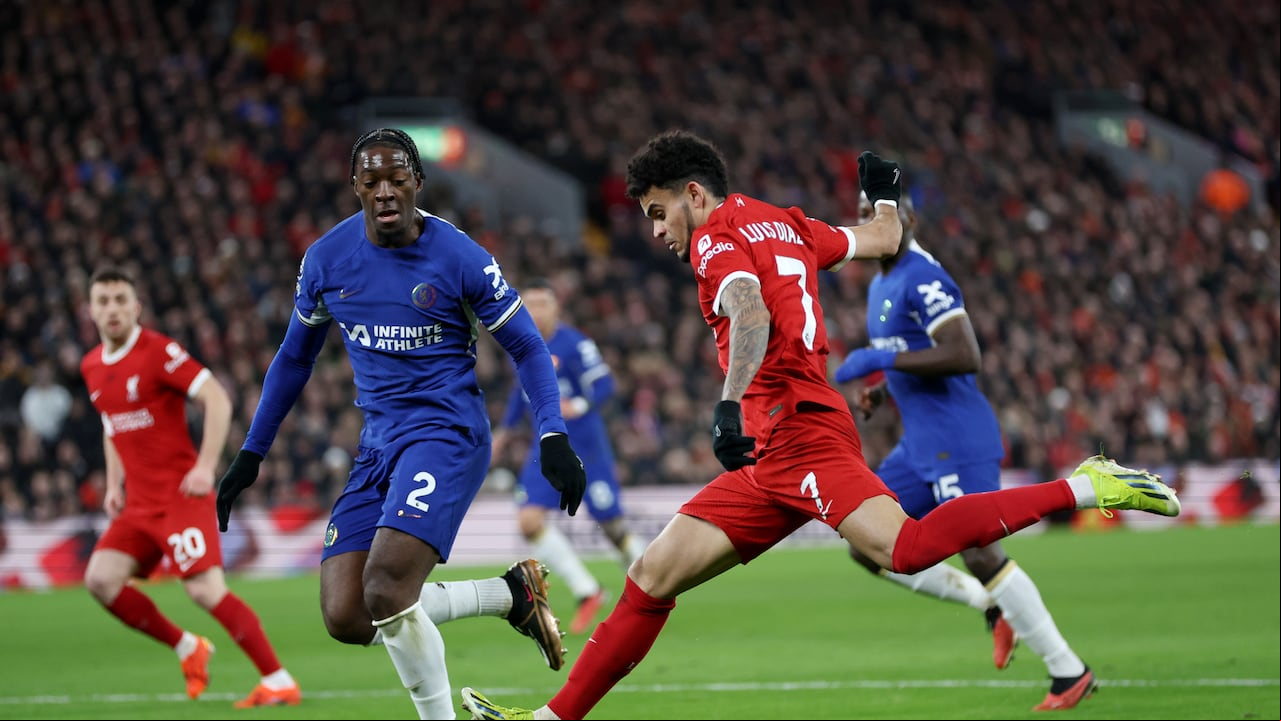 LIVERPOOL, ENGLAND - JANUARY 31: Luis Diaz of Liverpool shoots whilst under pressure from Axel Disasi of Chelsea during the Premier League match between Liverpool FC and Chelsea FC at Anfield on January 31, 2024 in Liverpool, England. (Photo by Clive Brunskill/Getty Images)