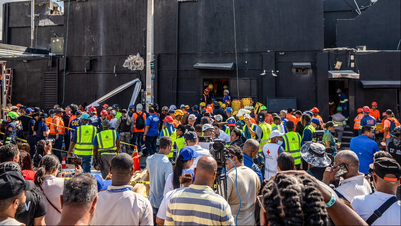Personnel of Civil Defence and firefighters inspect the Jet Set nightclub after the collapse of its roof, in Santo Domingo, on April 8, 2025. At least 27 people were killed when the roof of a nightclub in the Dominican Republic collapsed early Tuesday morning, emergency services said, with rescue operations still underway. (Photo by sco SPOTORNO / AFP)