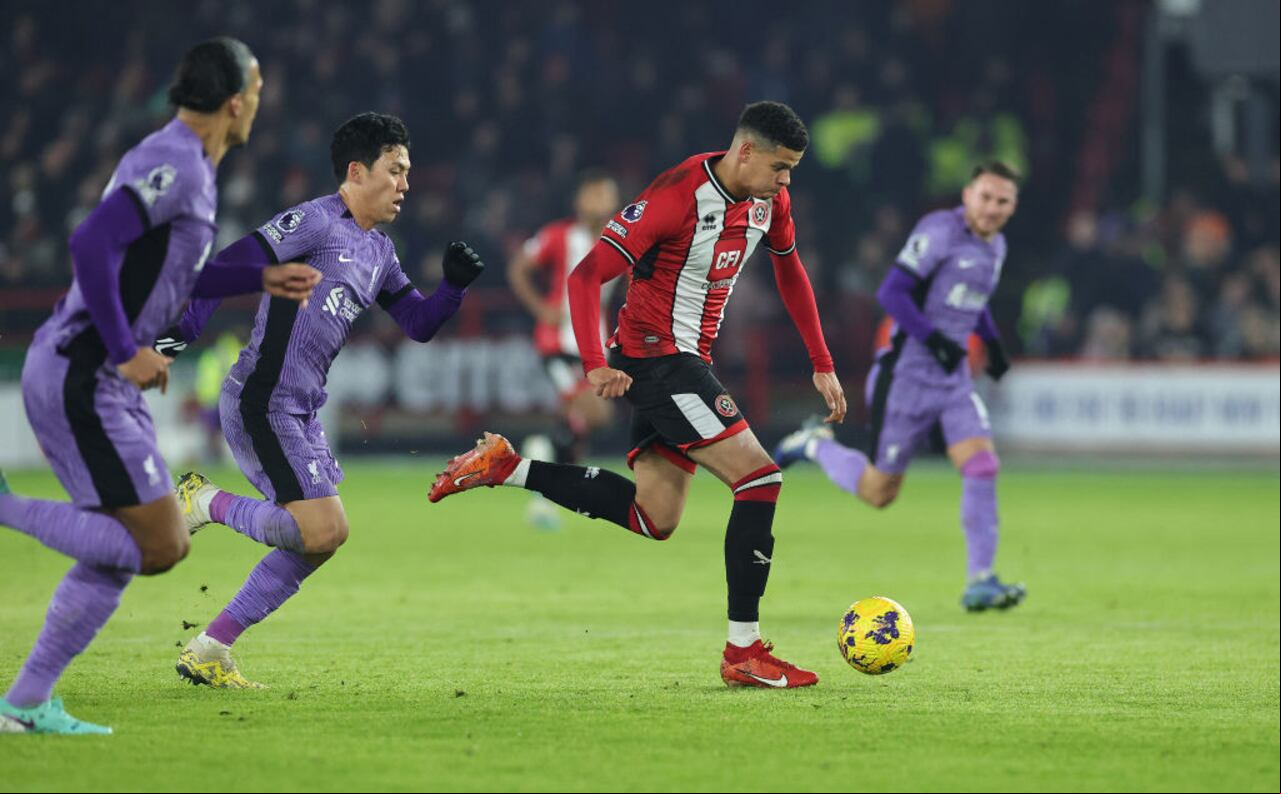 SHEFFIELD, ENGLAND - DECEMBER 06: Will Osula of Sheffield United runs with the ball during the Premier League match between Sheffield United and Liverpool FC at Bramall Lane on December 06, 2023 in Sheffield, England. (Photo by David Rogers/Getty Images)