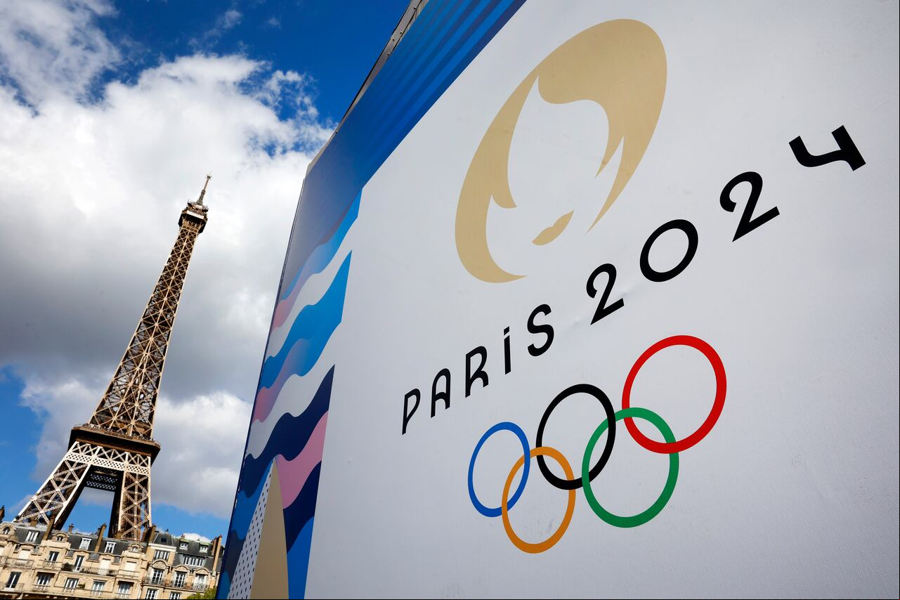 PARIS, - APRIL 21: The Paris 2024 logo, representing the Olympic Games is displayed near the Eiffel Tower three months prior to the start of the Paris 2024 Olympic and Paralympic games on April 21, 2024 in Paris, . The city is gearing up to host the XXXIII Olympic Summer Games, from 26 July to 11 August. (Photo by Chesnot/Getty Images)
