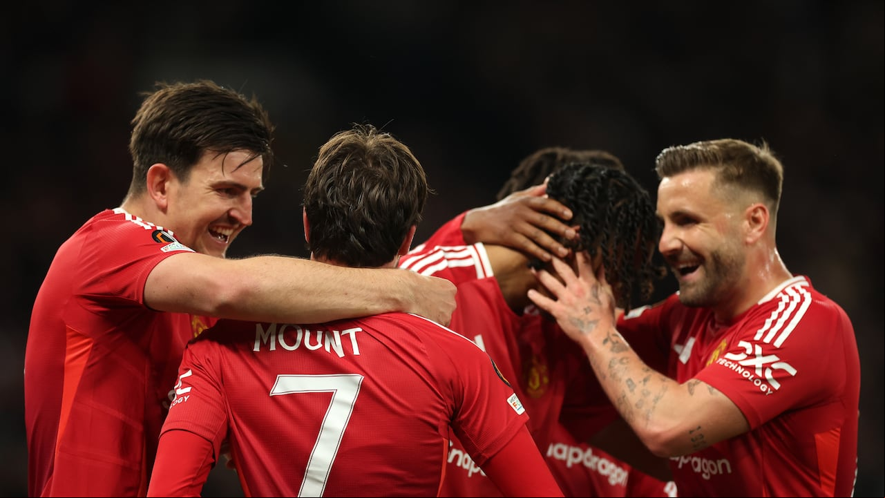 MANCHESTER, ENGLAND - MAY 08: Mason Mount of Manchester United celebrates scoring his team's first goal with teammate Harry Maguire during the UEFA Europa League 2024/25 Semi Final Second Leg match between Manchester United and Athletic Club at Old Trafford on May 08, 2025 in Manchester, England. (Photo by Carl Recine - UEFA/UEFA via Getty Images)