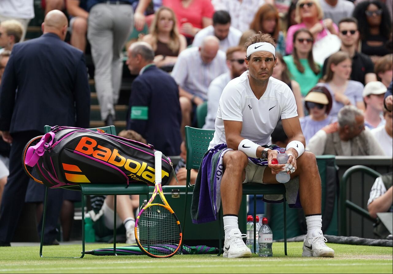 Rafael Nadal appears injured as he waits to receive treatment on day ten of the 2022 Wimbledon Championships at the All England Lawn Tennis and Croquet Club, Wimbledon. Picture date: Wednesday July 6, 2022. (Photo by Adam Davy/PA Images via Getty Images)