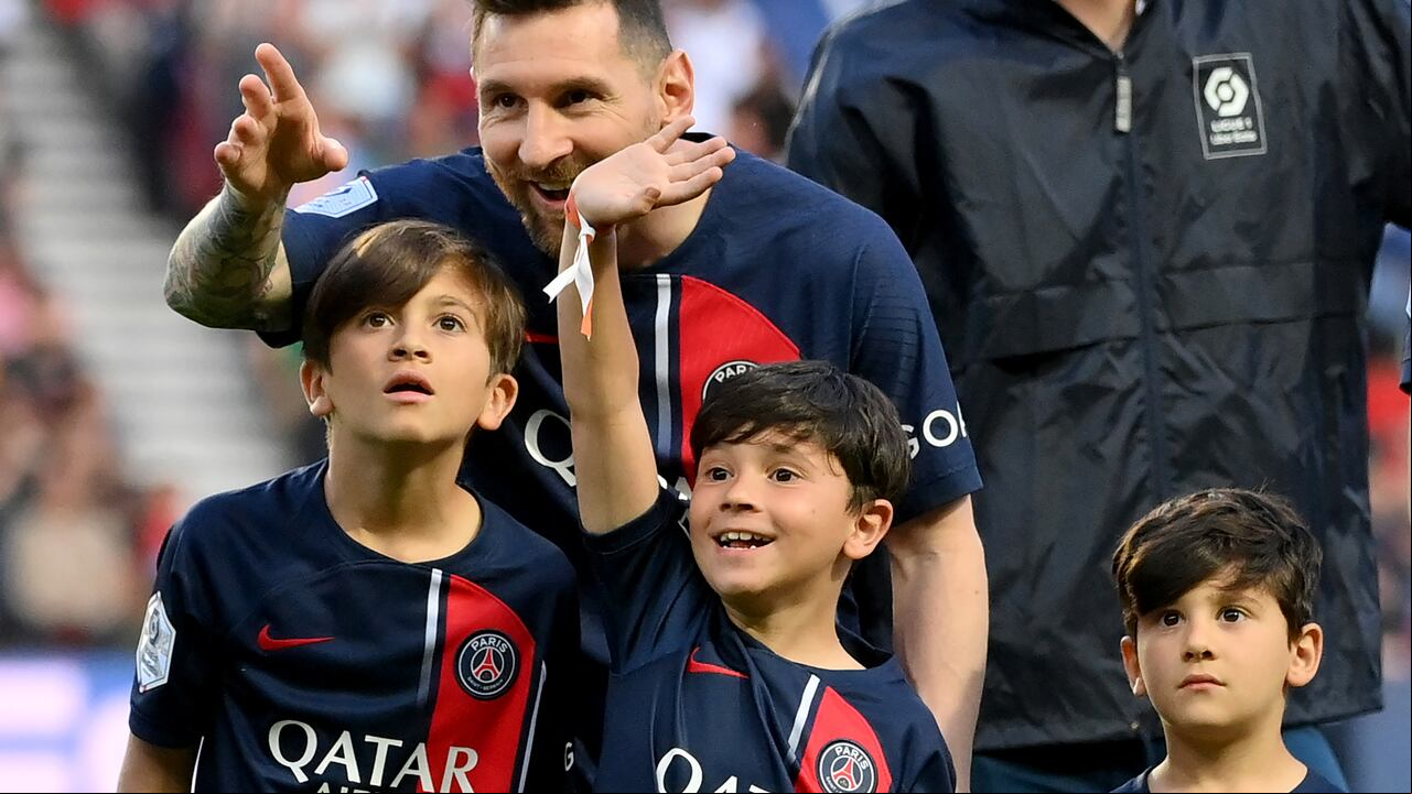 Paris Saint-Germain's Argentine forward Lionel Messi attends with his children prior to the French L1 football match between Paris Saint-Germain (PSG) and Clermont Foot 63 at the Parc des Princes Stadium in Paris on June 3, 2023. (Photo by FRANCK FIFE / AFP)