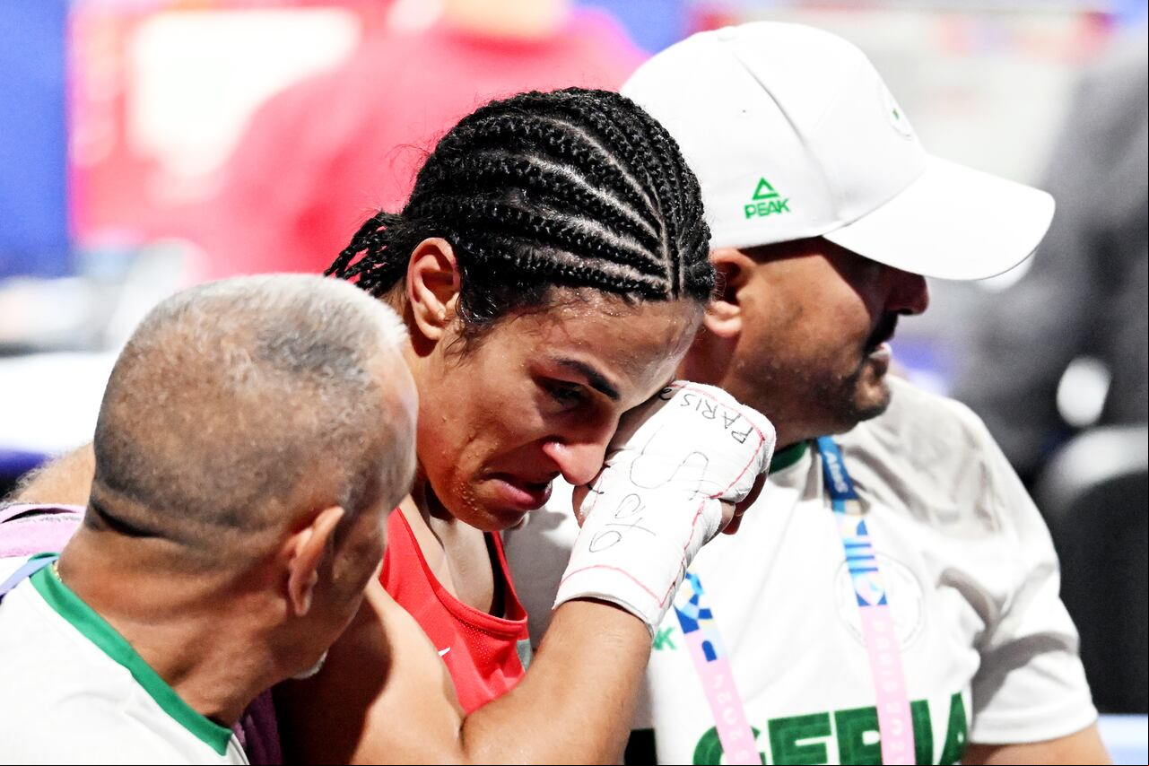 03 August 2024, , Paris: Olympia, Paris 2024, Boxing, Amateurs, Women, Quarterfinals, Welterweight (up to 66kg), Arena Paris Nord, Imane Khelif (l) from Algeria reacts after her fight against Luca Anna Hamori from Hungary (not pictured). Photo: Sina Schuldt/dpa (Photo by Sina Schuldt/picture alliance via Getty Images)