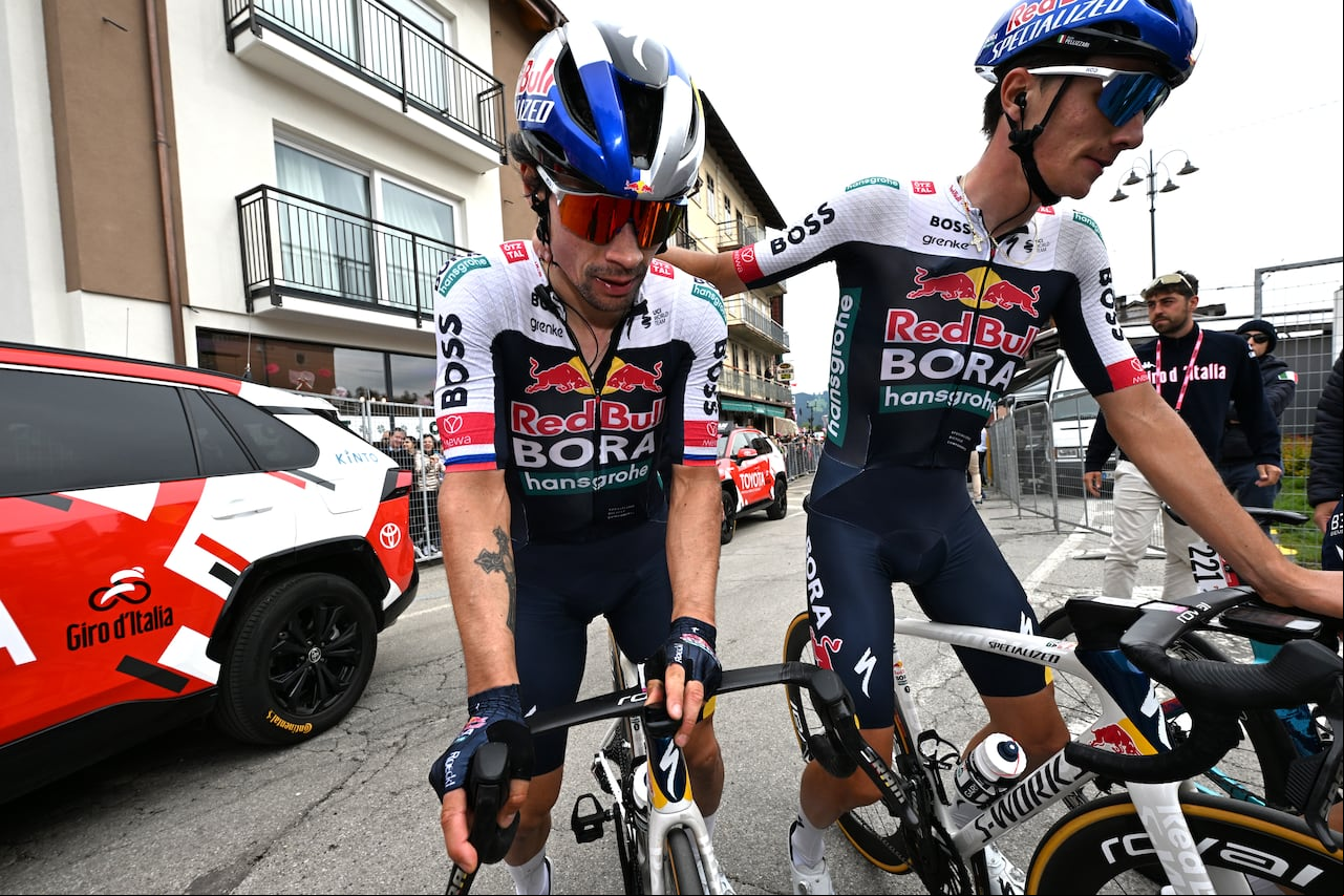 ASIAGO, ITALY - MAY 25: (L-R) Primoz Roglic of Slovenia and Giulio Pellizzari of Italy and Team Red Bull - BORA - hansgrohe react after the 108th Giro d'Italia 2025, Stage 15 a 219km stage from Fiume Veneto to Asiago / #UCIWT / on May 25, 2025 in Asiago, Italy. (Photo by Tim de Waele/Getty Images)