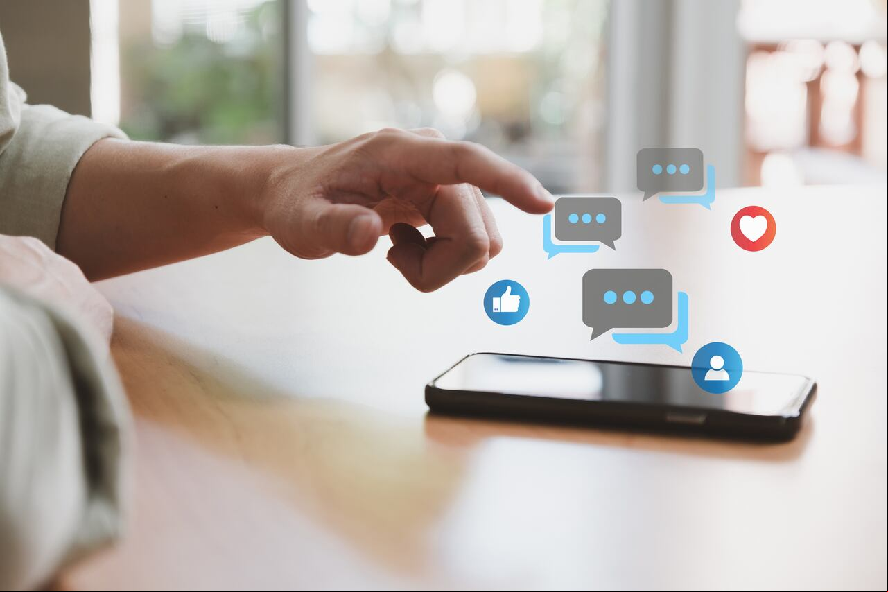 Selective focus at men hand while type on smartphone while chat and communication with friend on online social media platform. Virtual community that people can share or photo and content.