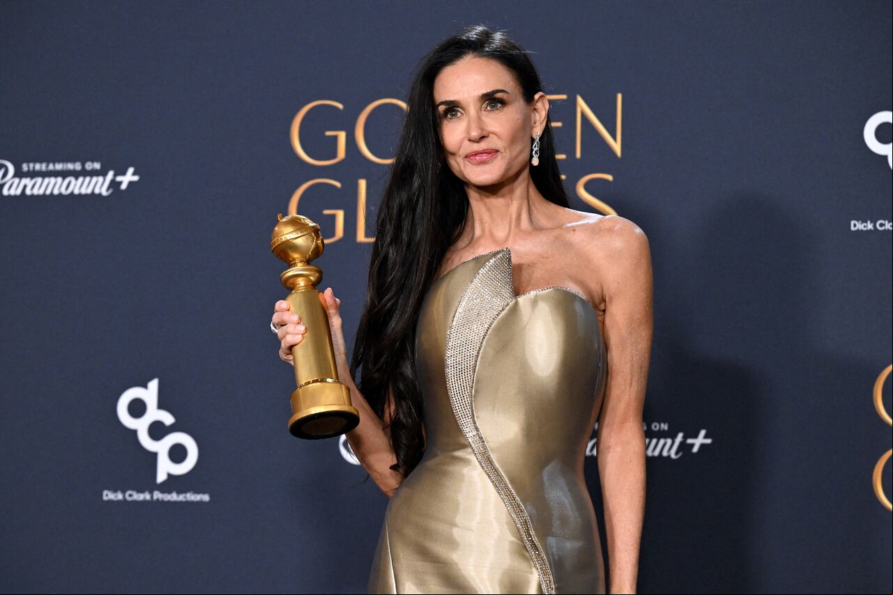 US actress Demi Moore poses with the Best Performance by a Female Actor in a Motion Picture � Musical or Comedy award for "The Substance" in the press room during the 82nd annual Golden Globe Awards at the Beverly Hilton hotel in Beverly Hills, California, on January 5, 2025. (Photo by Robyn Beck / AFP)